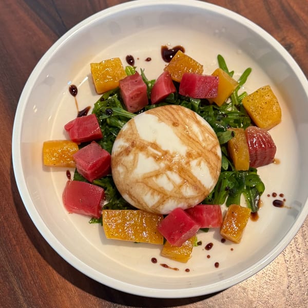 Burrata cheese with arugula, red and golden beets, drizzled with balsamic glaze at Crush'd Wine Bar Kitchen.